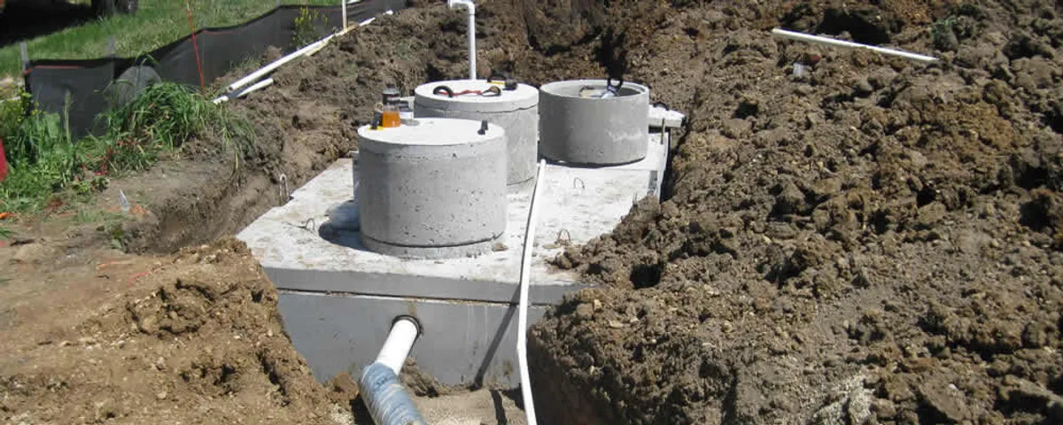 Septic system repair and installation site with tank access ports in Green Bay, WI